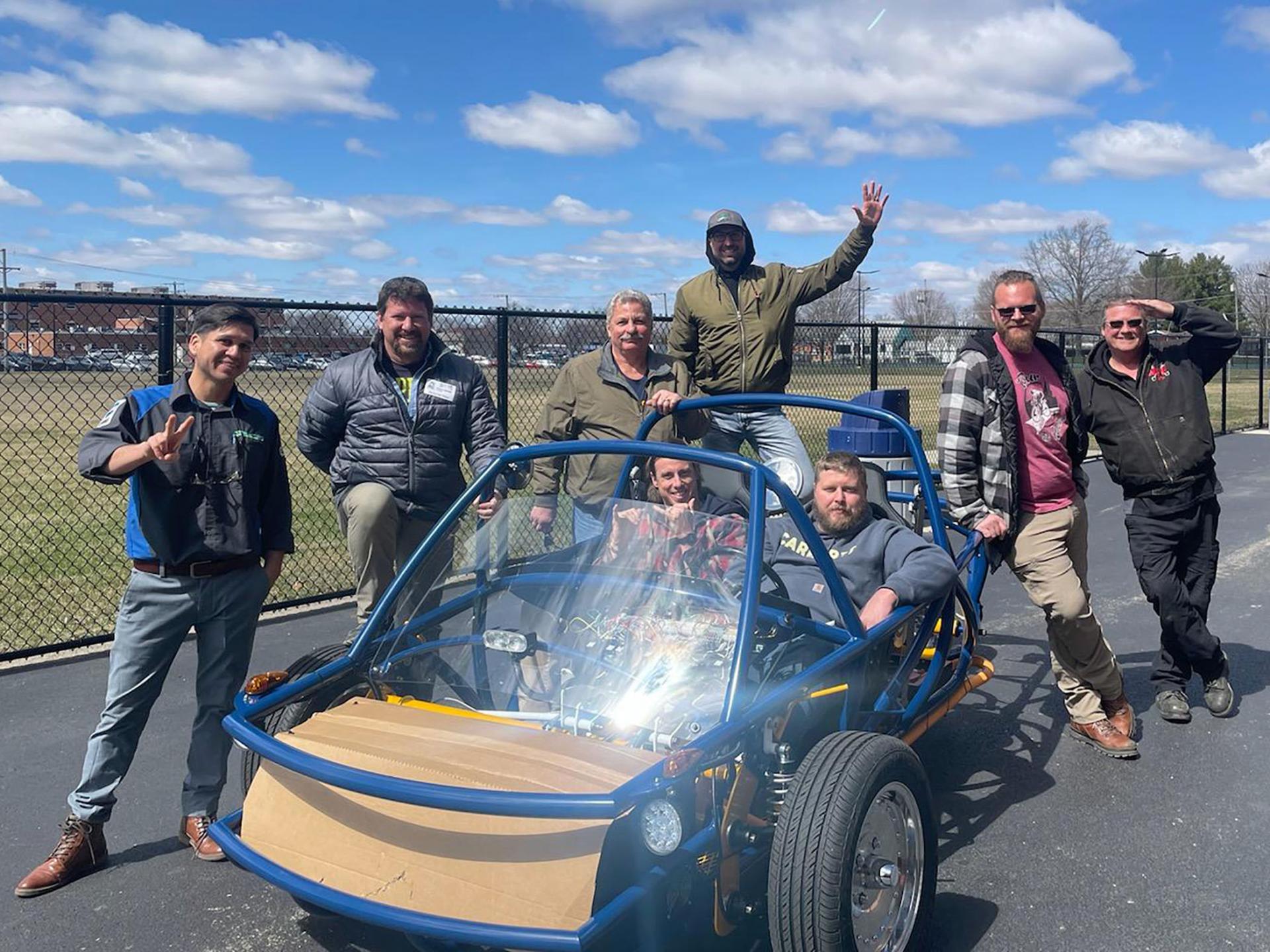 Lyndon Institute automotive instructor Dan Camber (second from left) traveled to Sterling, Illinois to take part in a week-long training program in the spring of 2022. Camber worked with six other teachers to build an electric-powered vehicle from scratch using a kit provided by The Switch Lab.
